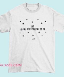 A heartfelt T-shirt with the phrase "She Means Everything To Me," often decorated with romantic or affectionate symbols like hearts or flowers.