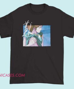 A T-shirt featuring an anime-style illustration emphasizing stylized, exaggerated character features, including prominent anime-inspired breasts, designed for fans of anime art and culture.