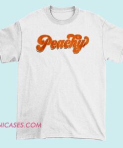 A peach-colored ringer T-shirt with contrasting collar and sleeve bands, featuring a casual and stylish design perfect for a relaxed, trendy look.