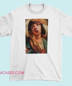 A T-shirt design inspired by Pulp Fiction featuring an illustration of Mia Wallace depicted as the Virgin Mary, blending pop culture with religious imagery.