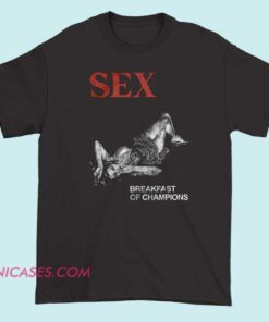 A T-shirt featuring the phrase "Sex Breakfast of Champions" with bold, playful typography and possibly humorous or illustrative elements related to breakfast or celebration, designed to make a fun and cheeky statement.