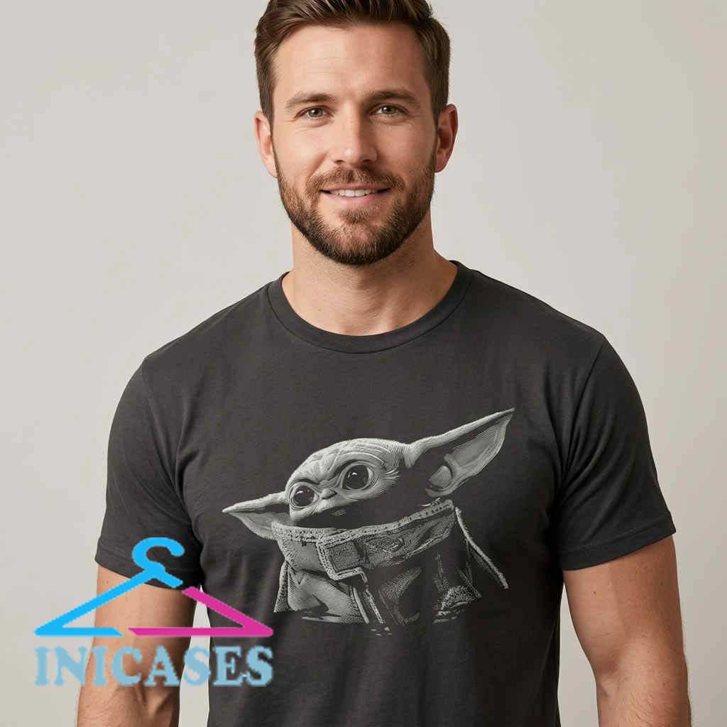 Star Wars Grogu Greyscale Portrait Baby Yoda Black Tee Star Wars Grogu Greyscale Portrait Baby Yoda Black Tee featuring a detailed monochrome Grogu graphic on a soft cotton shirt. Perfect for Star Wars fans, sci fi apparel lovers, and everyday casual wear.