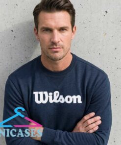Wilson Classic Logo navy crewneck sweatshirt with a clean graphic design, cotton material, casual athletic style, and versatile everyday appeal for sizes S to 2XL.