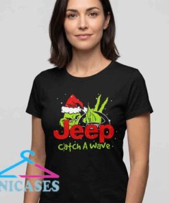 Grinch Jeep Christmas shirt featuring a playful Catch a Wave graphic, festive holiday artwork, beach adventure theme, cotton T-shirt design, casual seasonal apparel for Grinch and Jeep fans.