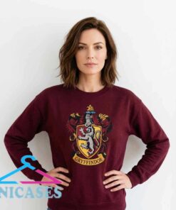 Harry Potter Gryffindor lion logo graphic shirt featuring burgundy-inspired wizarding style, cotton short sleeve apparel for Hogwarts fans, fantasy lovers, and collectors.