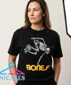 Vintage Bones Wheels Skate Skeleton graphic tee with retro skateboarding artwork, cotton short sleeve apparel for skateboarders, streetwear fans, and alternative fashion lovers.